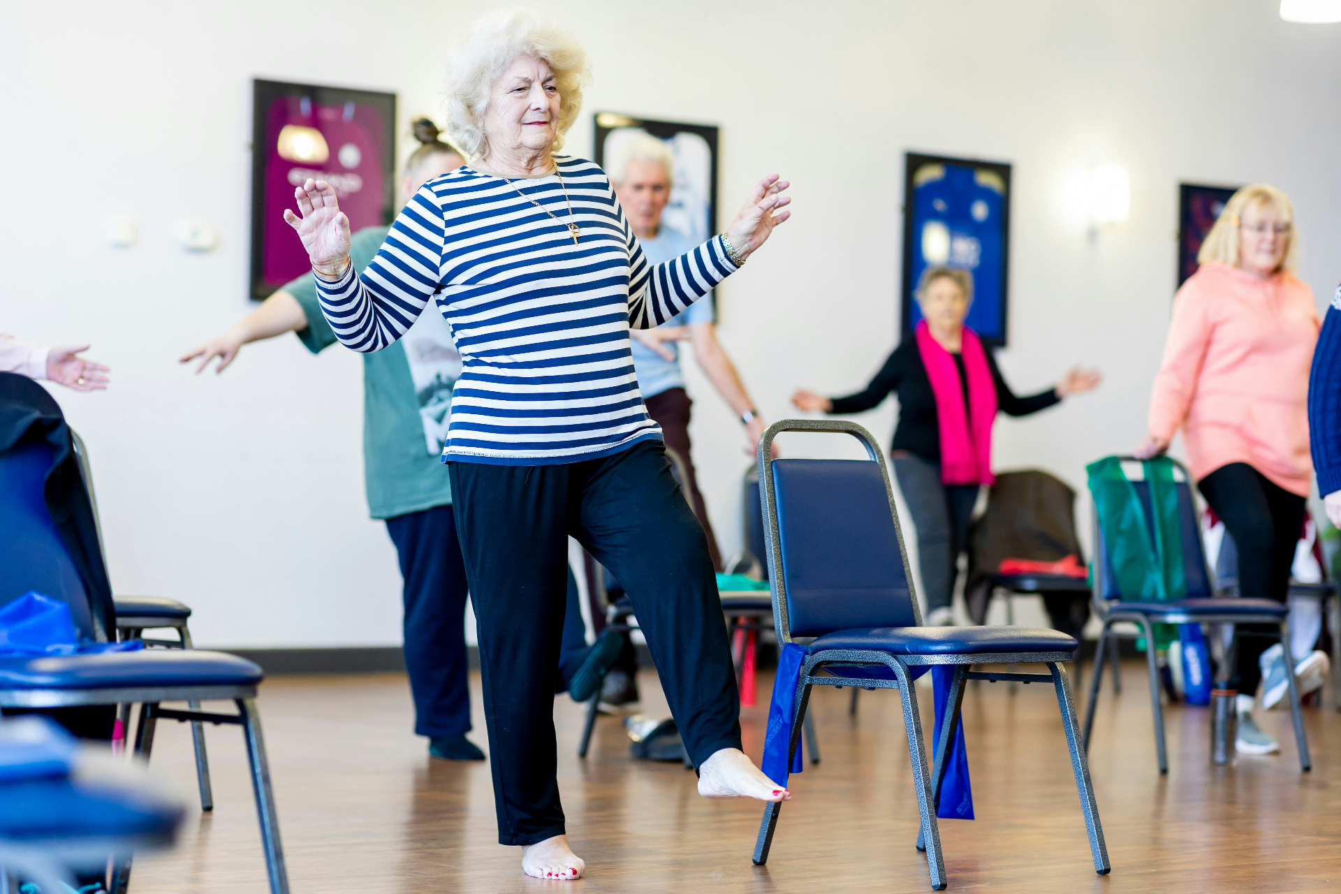 Seniors enjoying a chair-based exercise class together