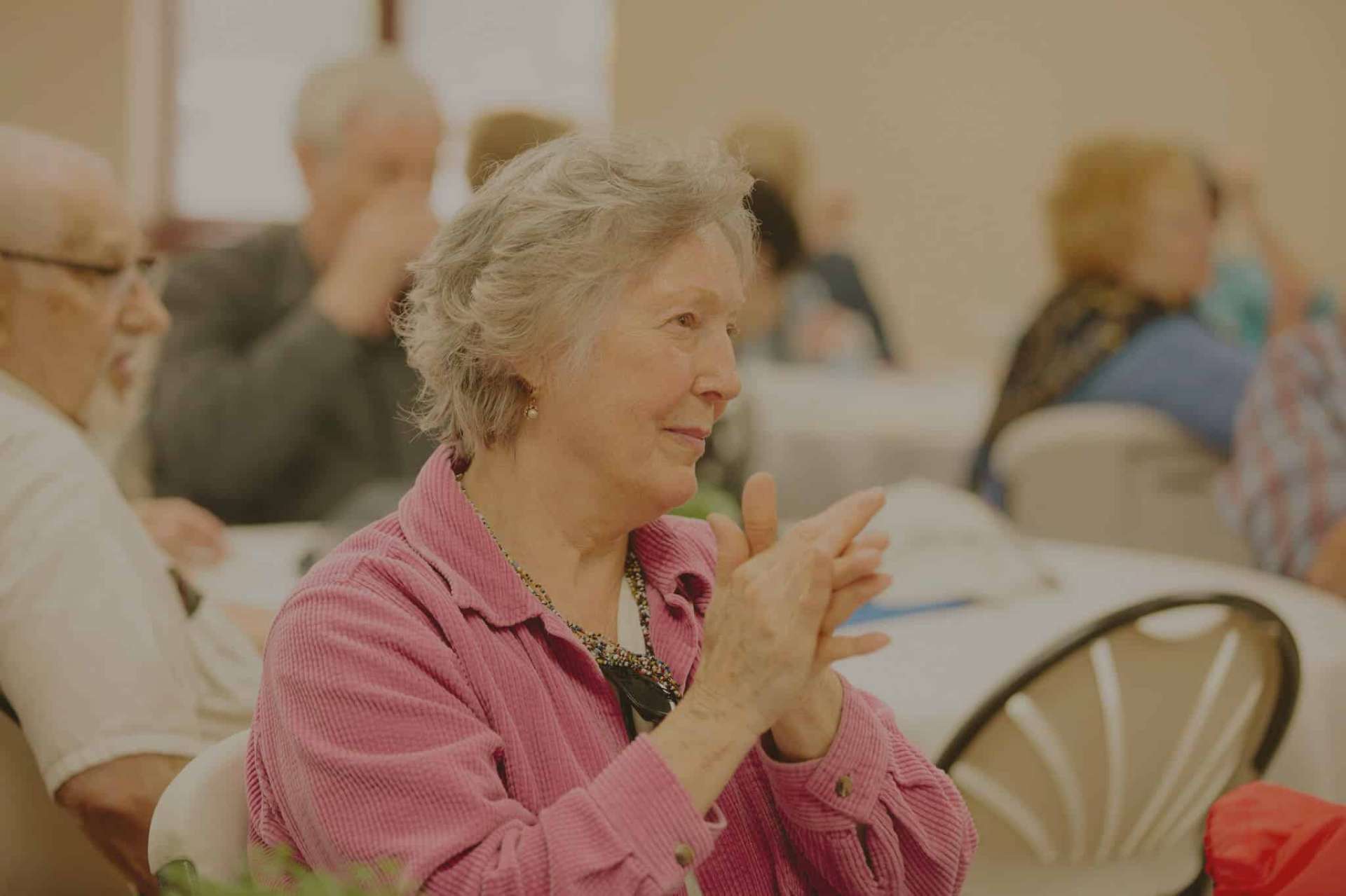 Caregiver helping a senior woman at home